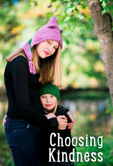Two sisters wearing hand knit animal hats